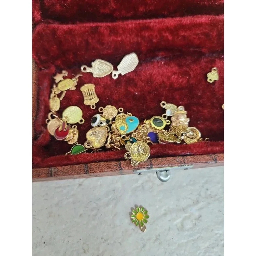 Faux alligator velvet lined box filled with charms